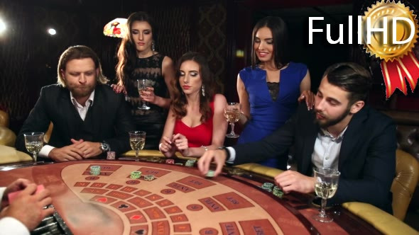 People Placing Their Bets on the Blackjack Table