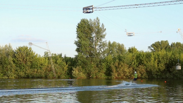 Athlete Wakeboarder Floats on Water alt
