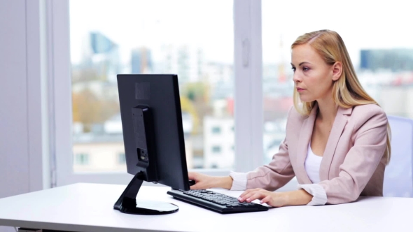 Young Businesswoman With Computer Typing At Office 9 alt