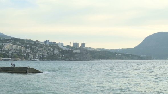Man In A Wheelchair At The Sea