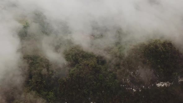 The Panoramic View of the Fast Clouds Moving Above the Rainforest to the Mountains