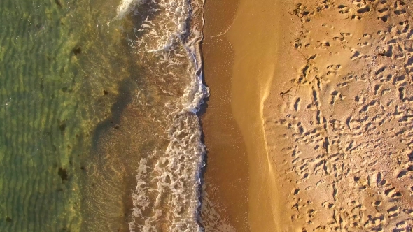 AERIAL VIEW. Waves Splashing Along The Beach In Crimea