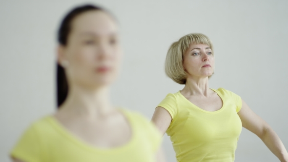 Young Women Are Practicing The Accomplished Pose  alt