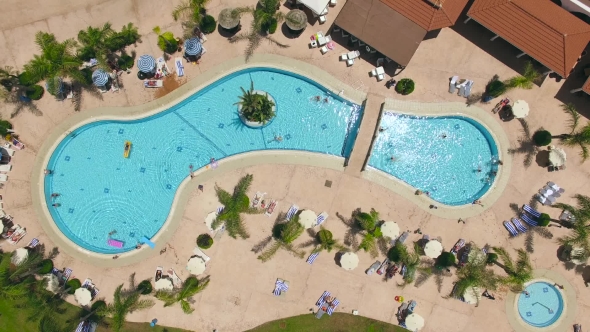 Aerial View Of Swimminig Pool With Vacationers alt