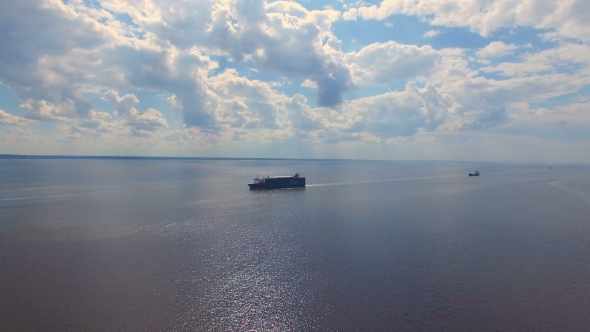 Aerial view of cargo ships floating on water alt