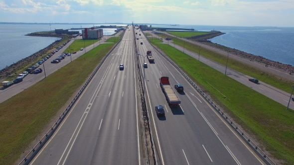 aerial view of the highway on the dam in kronstadt which go cars