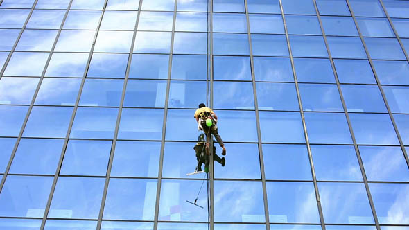 Man Cleaning Windows of Office Building 2