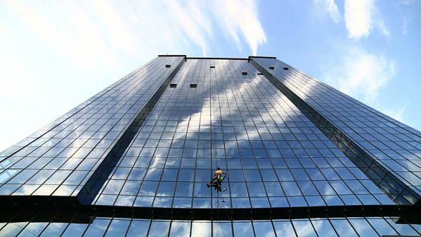 Man Cleaning Windows of Office Building 3