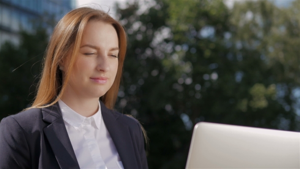 Portrait Of Beautiful Business Woman Using Laptop PC Outside Business Center alt