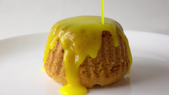 Covering Freshly Baked Muffin With Yellow Sauce  Video alt