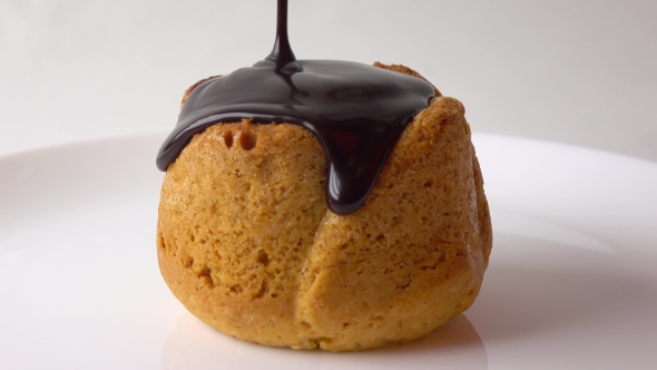 Covering Freshly Baked Muffin With Dense Chocolate Sauce  Video alt