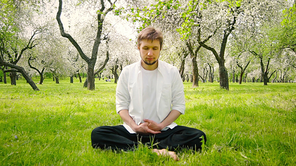 Man Meditating in The Park