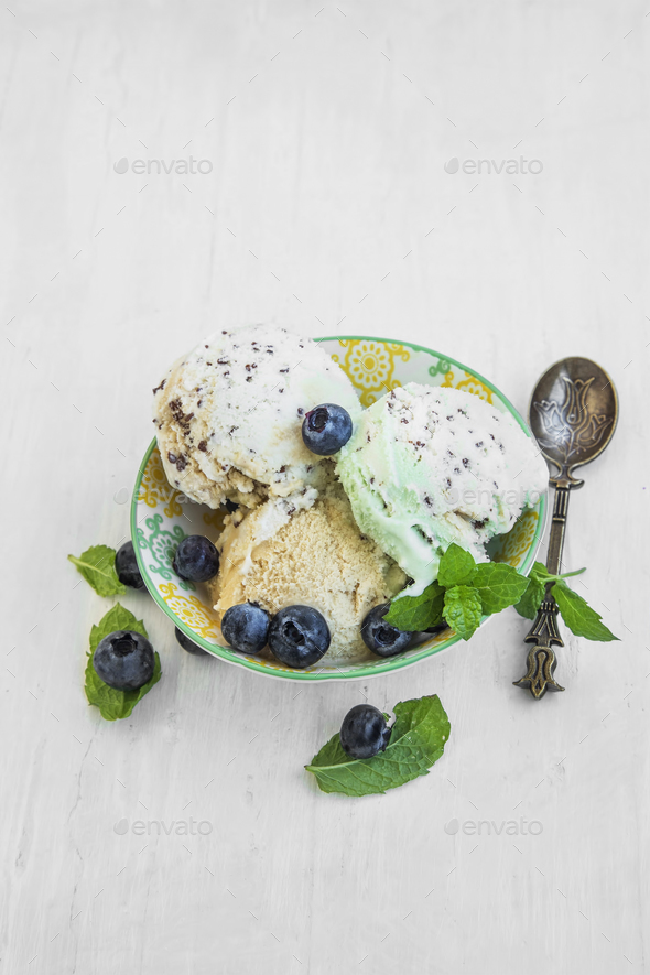 Mint,vanilla and cocoa icecream with blueberries and mint leaves