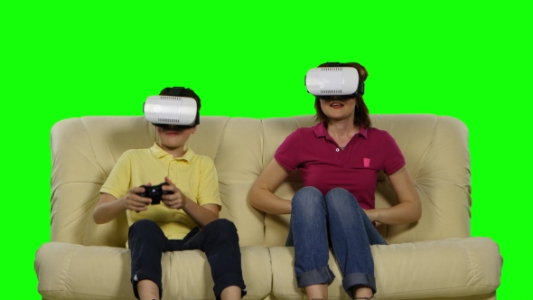 Virtual Reality Mask. Young Mother And Her Son With Pleasure Play With The Head-mounted Display alt