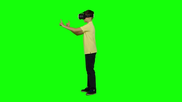 Virtual Reality Mask. Ghild Uses Head-mounted Display. Green Screen alt
