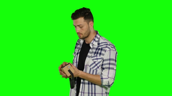 Virtual Reality Game. Boy Uses Head Mounted Display. Green Screen alt