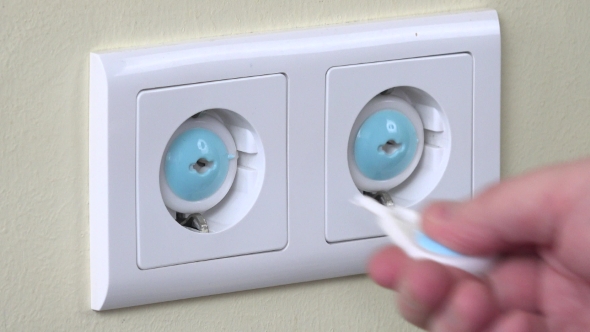 Hand Remove Safety Plug From Electricity Outlet And Insert Plug Wire