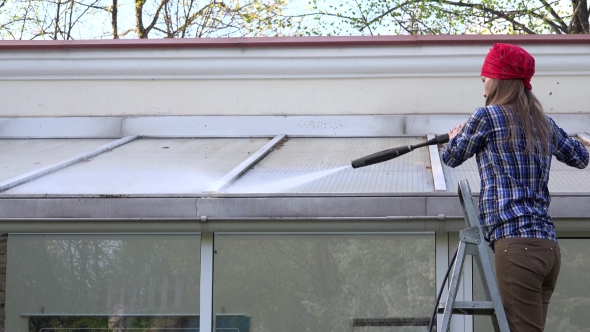 Exterior Washing And Building Cleaning Glass Roof With High Pressure Water Jet.