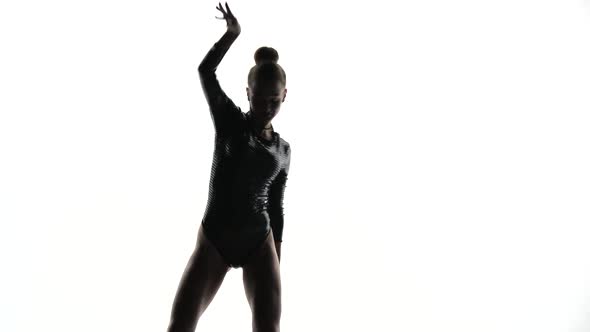 Dancer Silhouette in a White Studio alt