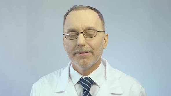 Male Therapist Looking Kindly at Patient Sympathetic Smile on Face Medicine alt