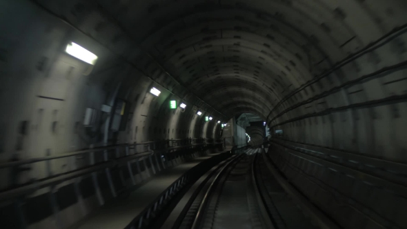 Train Making His Way In Dark Underground Tunnel alt
