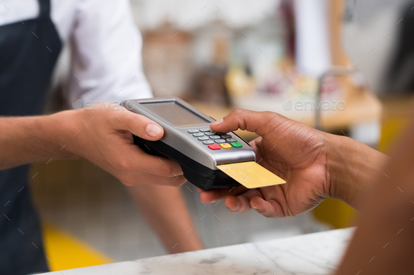 Paying by credit card reader - Stock Photo - Images