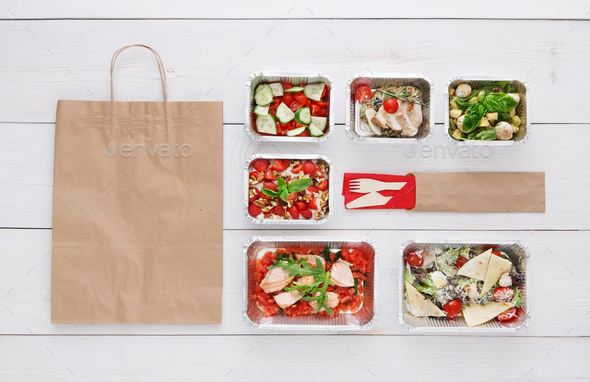 Healthy food take away in boxes, top view at wood - Stock Photo - Images