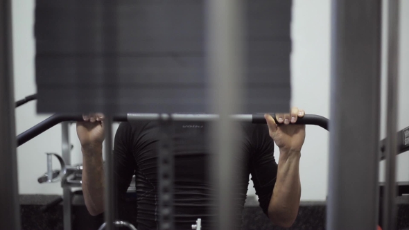 Man Is Engaged On a Simulator Of Upper Thrust Block.