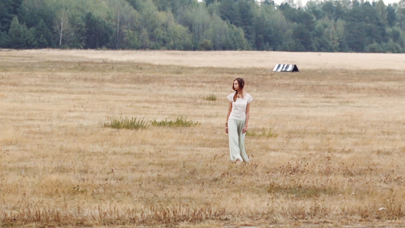 Girl Goes Through The Yellow Field