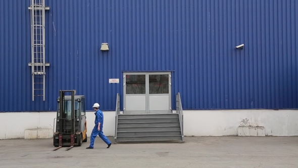 Loader Sits In Electric Forklift And Drive It alt