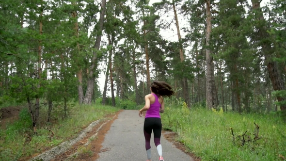 Active Weekend. Young Attractive Woman , Running Through The Park. . alt