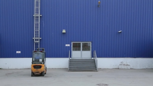 Loader Sits In Electric Forklift And Drive It alt