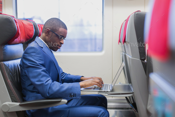 Business passenger in a train - Stock Photo - Images