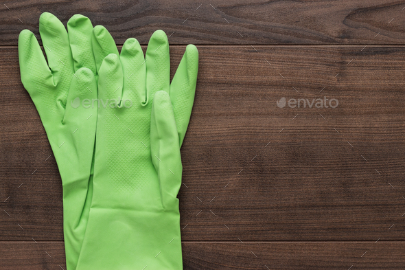 green rubber cleaning gloves - Stock Photo - Images