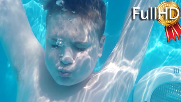 Teen Boy Dives in Blue Pool With Closed Eyes and