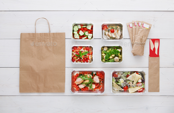 Healthy food take away in boxes, top view at wood - Stock Photo - Images