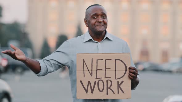 Unhappy Black African American Businessman Holding Cardboard Need Work Emotional Pointing on Sign alt