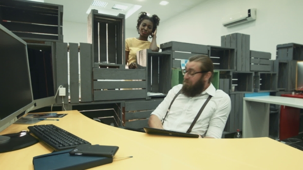 African Woman Throwing Back Paper Plane At Her Colleague In Office alt