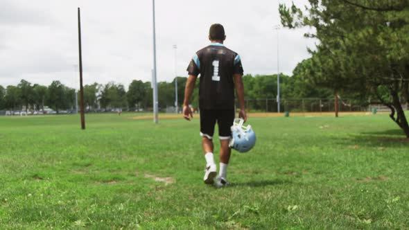 American Football Player Walks After Practice 07