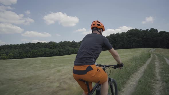 Video Following Mountainbiker in Rural Landscape