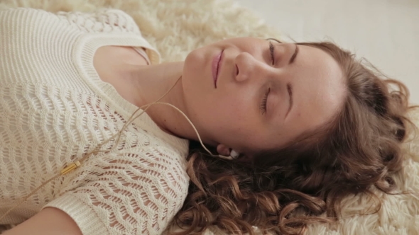 Woman Listening Music In Headphones