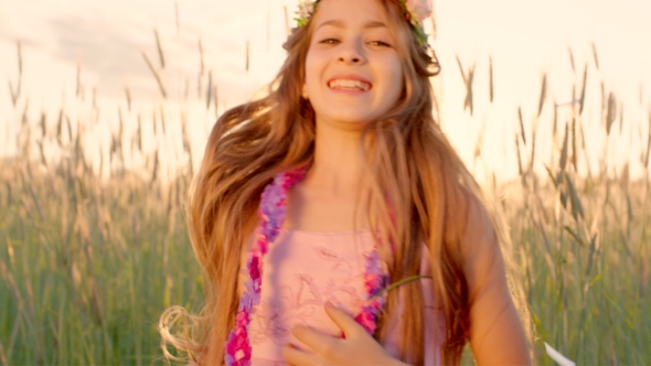 Young Girl Dancing Under Confetti Rain In The Wheat Field During Sunset alt