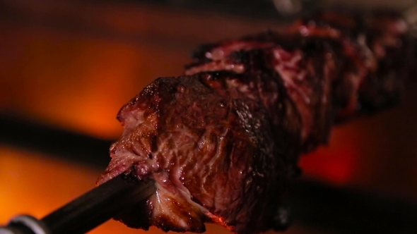 Meat On Skewer Roasting On The Fire