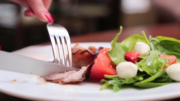 Eating Salad With Fork And Knife 