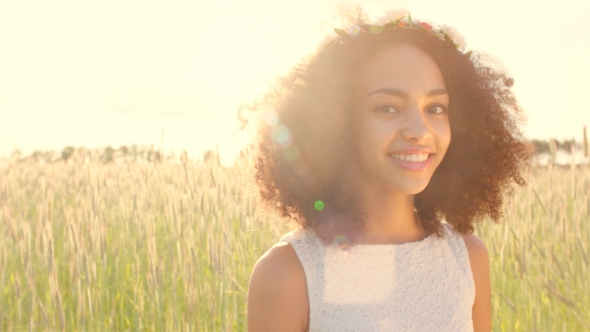 Of Young Girl Wearing Flower Wreath In Sunset alt