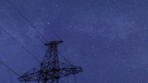 Power Transmission Line Tower On a Starry Sky. alt