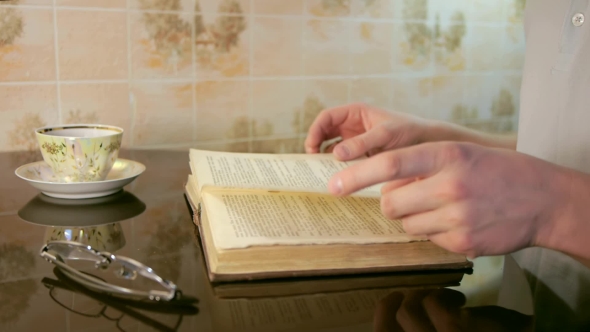 Man Leafing Through Pages alt