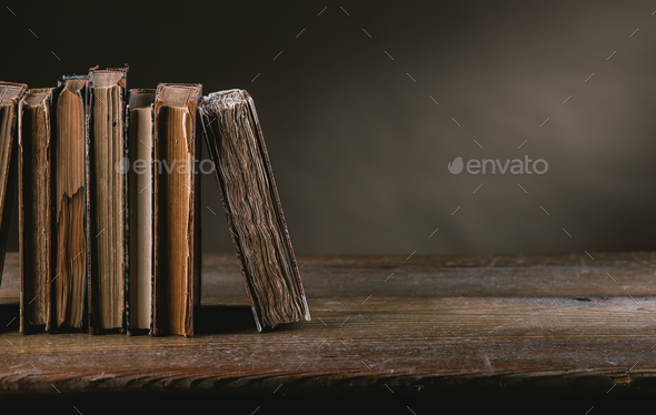 Ancient books on an old table - Stock Photo - Images