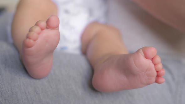A Close Up of a Baby Feet alt