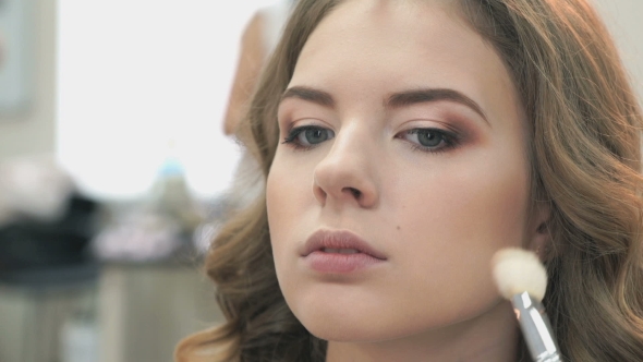 Makeup Artist Making Make-up For a Girl